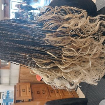 Sew in weave by Shikrat Hair Stylist in Denver, Colorado